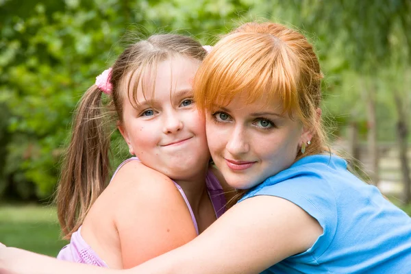 Portrait of woman with daughter — Stock Photo, Image