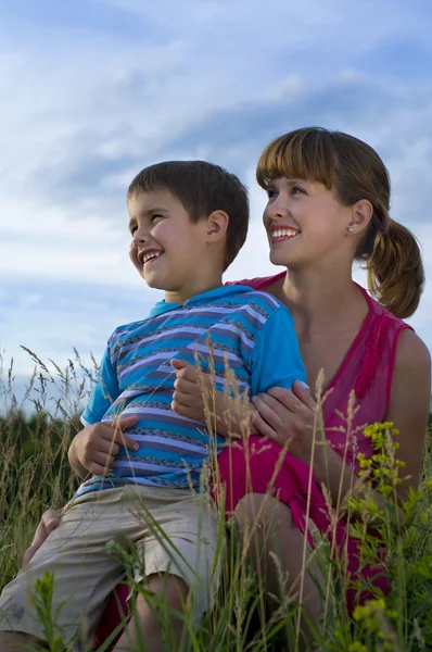 Mother with a son on to the meadow — Stock Photo, Image