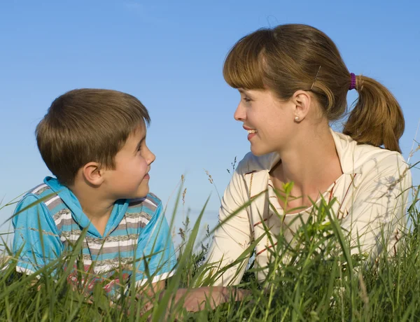 Mother with a son on the meadow — Stock Photo, Image