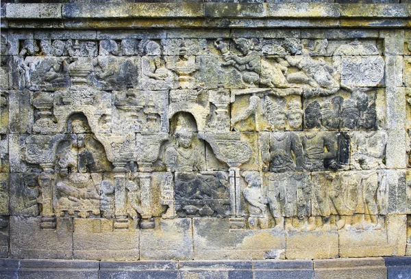 Detail vyřezávaný reliéf Borobuduru na Jáva, Indonésie. — Stock fotografie