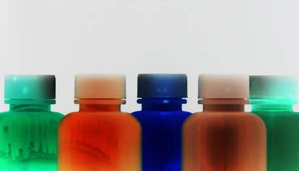 Liquido colorato in bottiglie grunge — Foto Stock