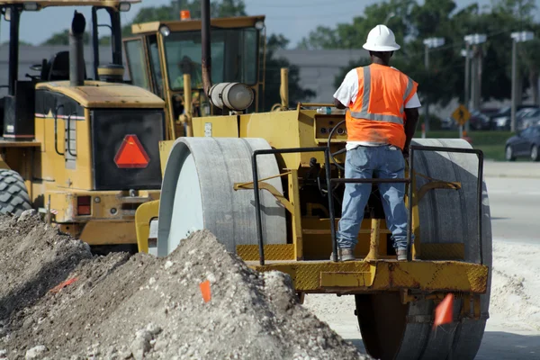 stock image Worker Operating a Compactor (1)