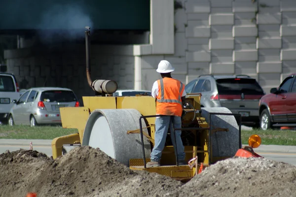 stock image Worker Operating a Compactor (2)