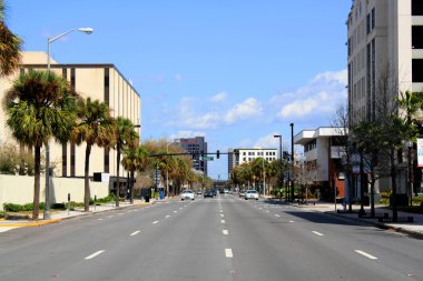 A view of downtown Orlando, Florida, looking north on Orange Avenue at Amelia Street. clipart