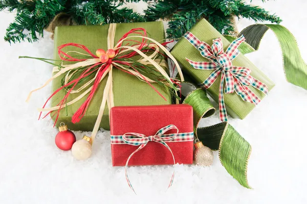 Three festive wrapped gifts — Stock Photo, Image