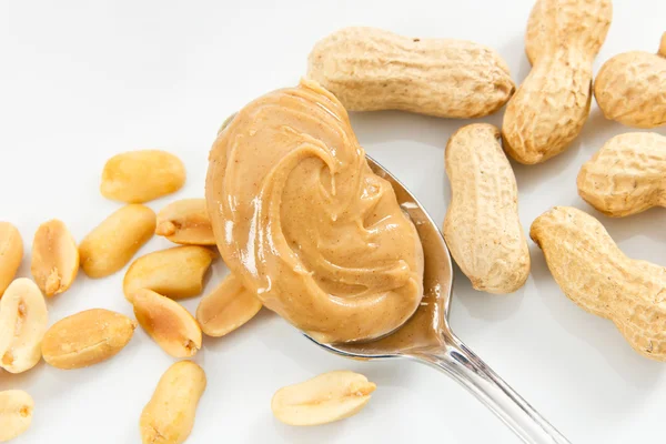 Amendoins e manteiga de amendoim — Fotografia de Stock