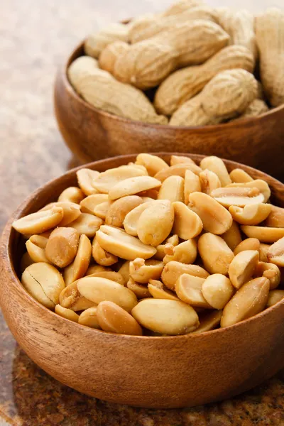 Peanuts in wood bowls Royalty Free Stock Images