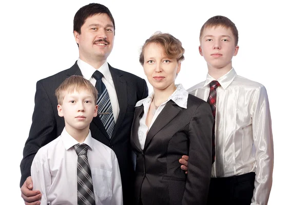 Retrato de família de quatro em ternos — Fotografia de Stock