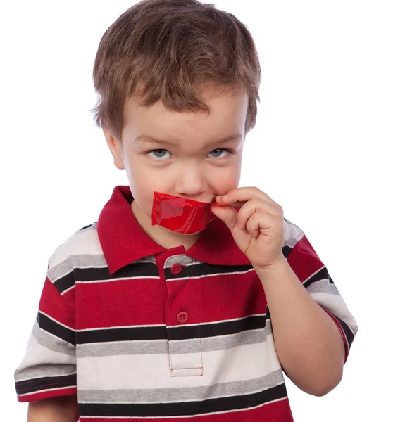 The boy's mouth by red tape — Stock Photo, Image