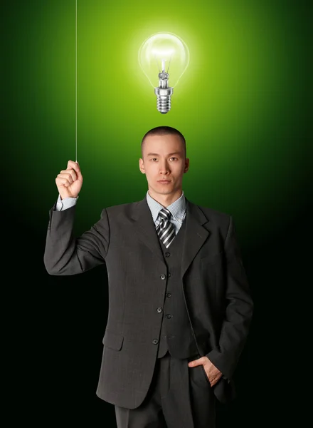 Uomo d'affari accendere la luce — Foto Stock