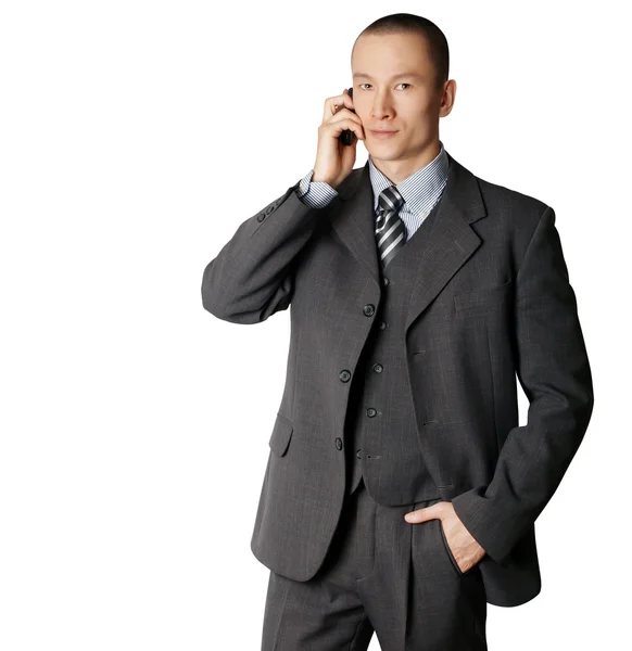 Деловой человек в костюме говорит по телефону — стоковое фото