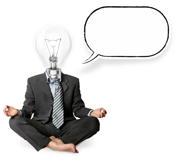 Podnikatel v lotus pose a hlava svítilny s myšlenkou bublina — Stock fotografie
