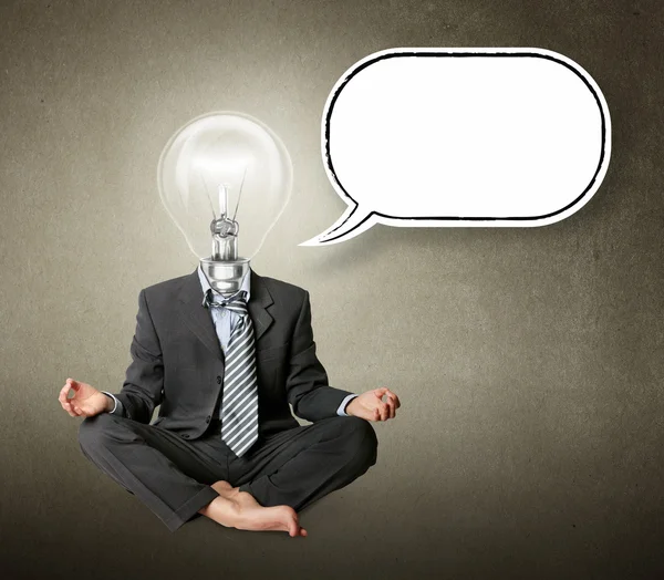 Empresario en pose de loto y cabeza de lámpara con burbuja de pensamiento —  Fotos de Stock