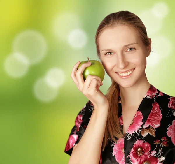 stock image Happy woman with agreen apple