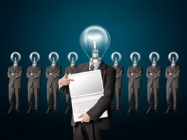 Male businessman with lamp-head and laptop have got an idea clipart