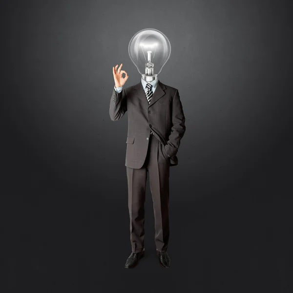 Full length business male with lamp-head — Stock Photo, Image