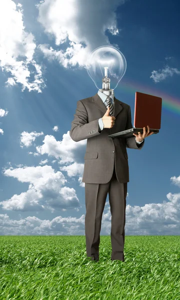 Businessman with lamp-head outdoors — Stock Photo, Image