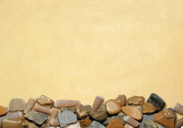 Hintergrund mit Steinen und altem Papier 01 — Stockfoto