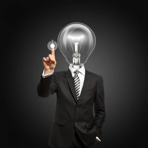 Businessman with lamp-head push the button — Stock Photo, Image