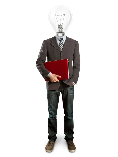 Muž v obleku s lampu a laptop ve svých rukou — Stock fotografie