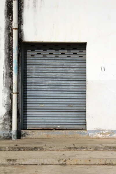 stock image Grunge iron door with sewer