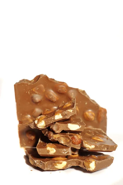 Cioccolato con noci su sfondo bianco — Foto Stock