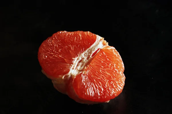 Fresh grapefruit on black Isolation. — Stock Photo, Image
