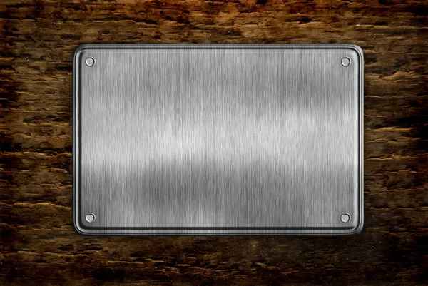 Metal sign on wood plank background — Stock Photo, Image