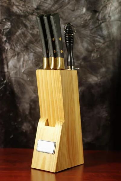 Knife block on wooden table — Stock Photo, Image