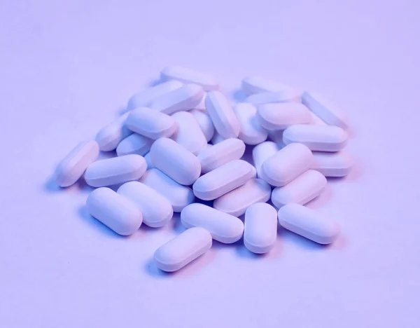 Pills background with blue and pink shadow — Stock Photo, Image