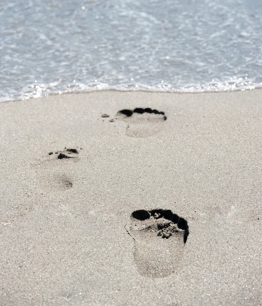 Footprints at beach — Stock Photo, Image