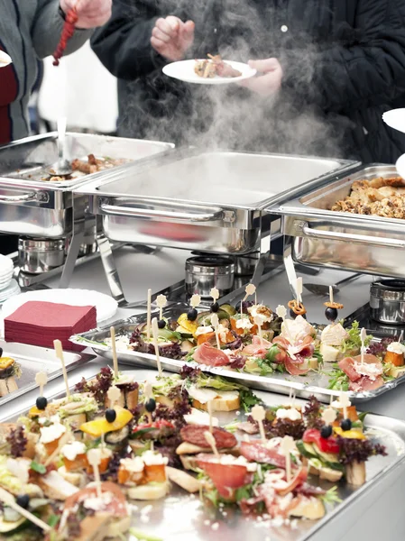Choosing food from buffet — Stock Photo, Image
