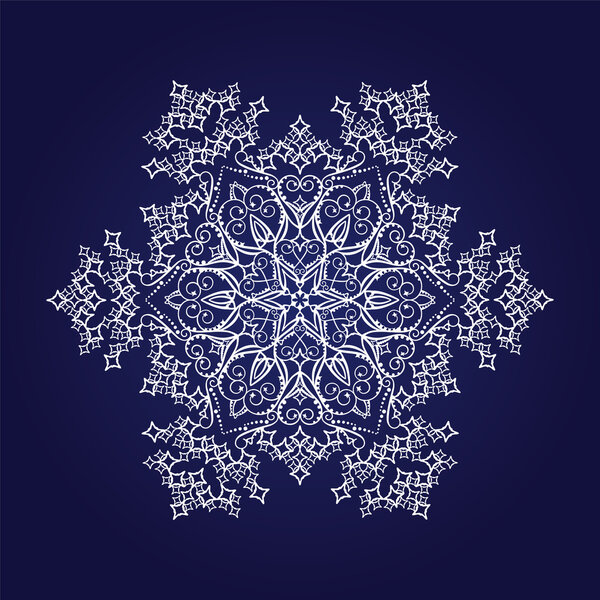 Detailed snowflake on dark blue background