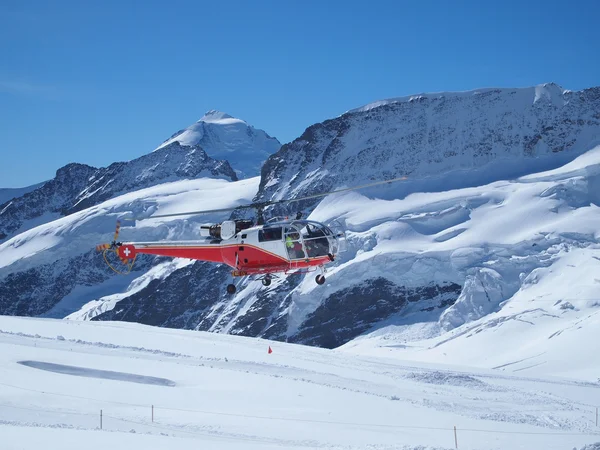 stock image Flying Helicopter at Jungfrau Top of Europe in the Swiss Mountai