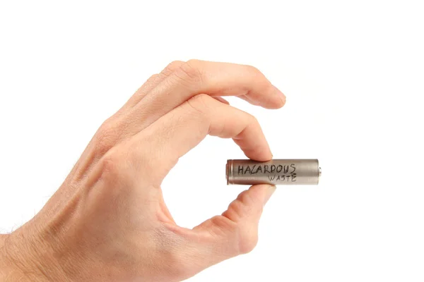 Återvinning koncept: batteri i handen — Stockfoto