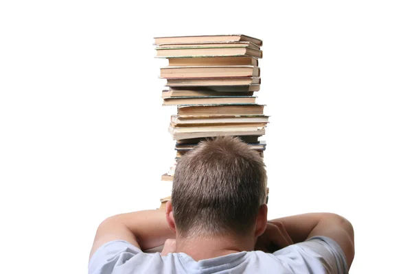 Стресс молодой студент с грудой книг, чтобы прочитать — стоковое фото