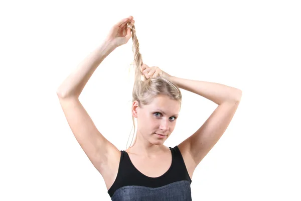Woman making her hairstyle — Stock Photo, Image