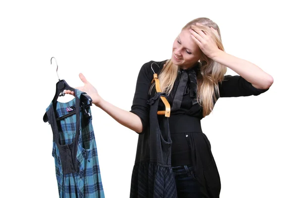 Mulher escolhe entre dois vestidos — Fotografia de Stock