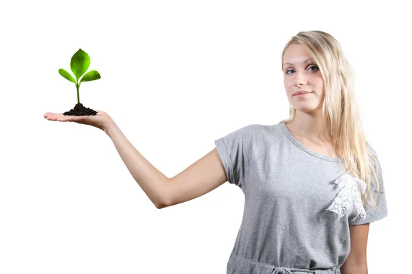 Eco concept: bella donna con pianta verde nel palmo della mano — Foto Stock