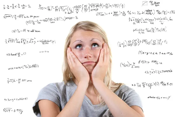 Mujer desesperada con muchas ecuaciones matemáticas a su alrededor — Foto de Stock