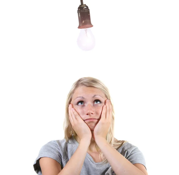 Woman with light bulb above her head — Stock Photo, Image