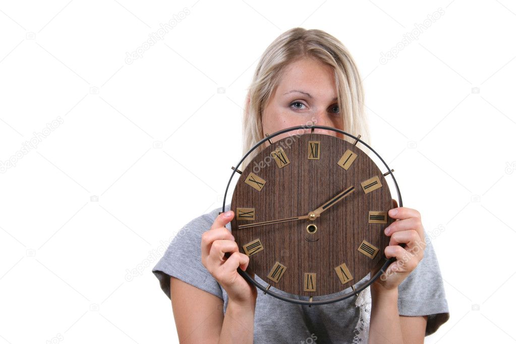 Woman holding clock in front