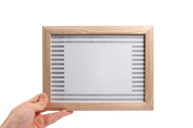 Wooden photo frame in the hand clipart