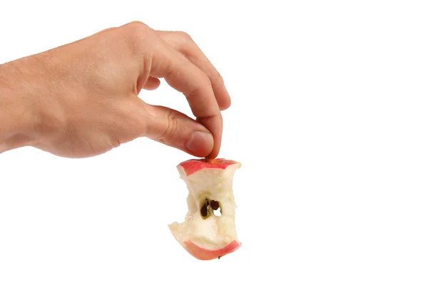 Mão segurar núcleo de maçã — Fotografia de Stock