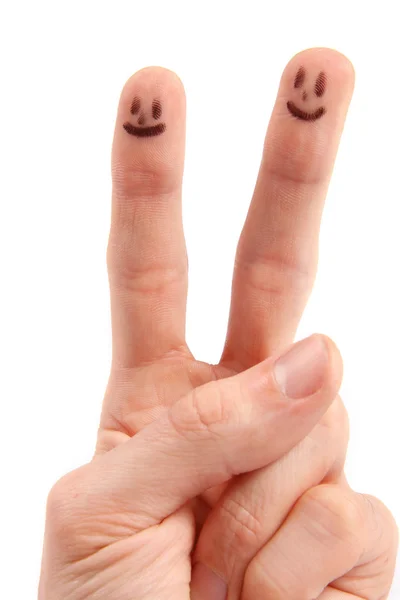 Mão com smileys na ponta dos dedos — Fotografia de Stock