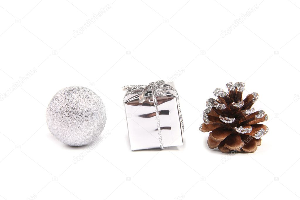 Three decorative objects for christmas - ball, gift and pinecone