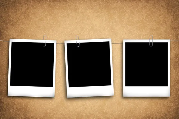 Blank photo frames on a grungy background — Stock Photo, Image