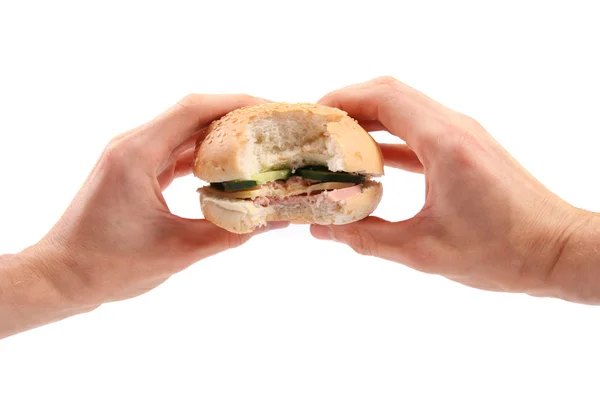 Beyaz arka plan üzerinde izole hamburger ellerini tutun — Stok fotoğraf