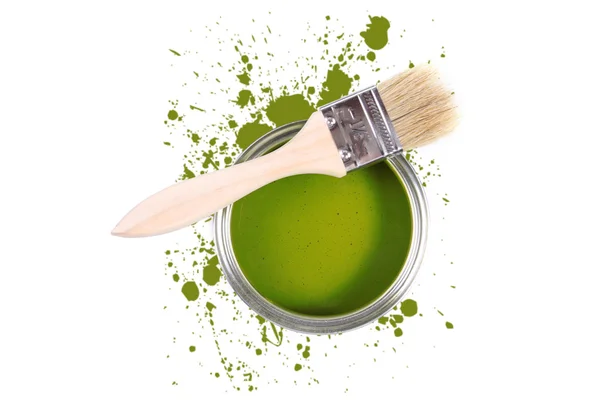 Lata de pintura verde con pincel y manchas de color —  Fotos de Stock