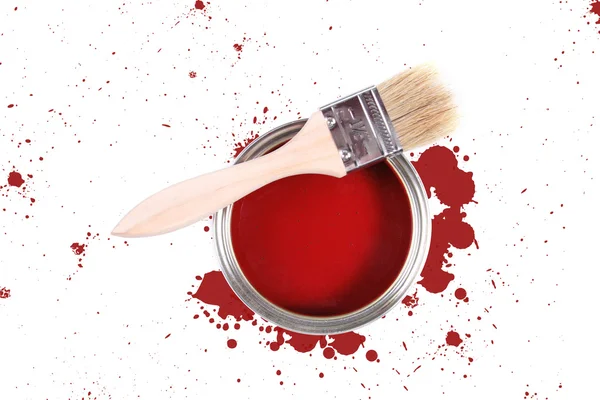 Red paint can with brush and color stains — Stock Photo, Image